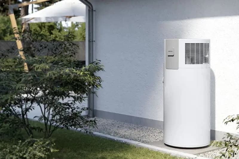 A heat-pump hot-water system outside a home.